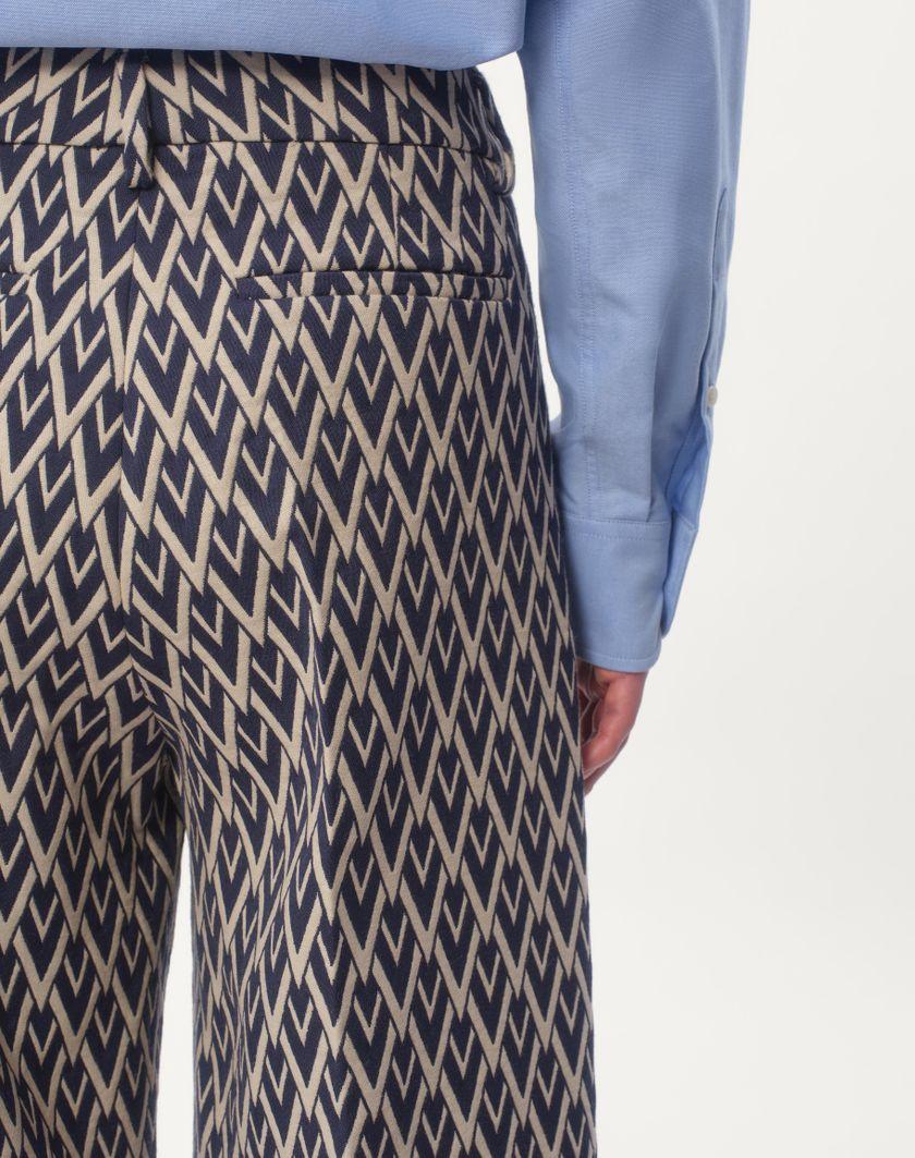 Valentino Handbags Pantalone In Lana Con Risvolto Con Motivo Jacquard Toute La V per Uomo in Notte/crema | Valentino IT Acquista Ora