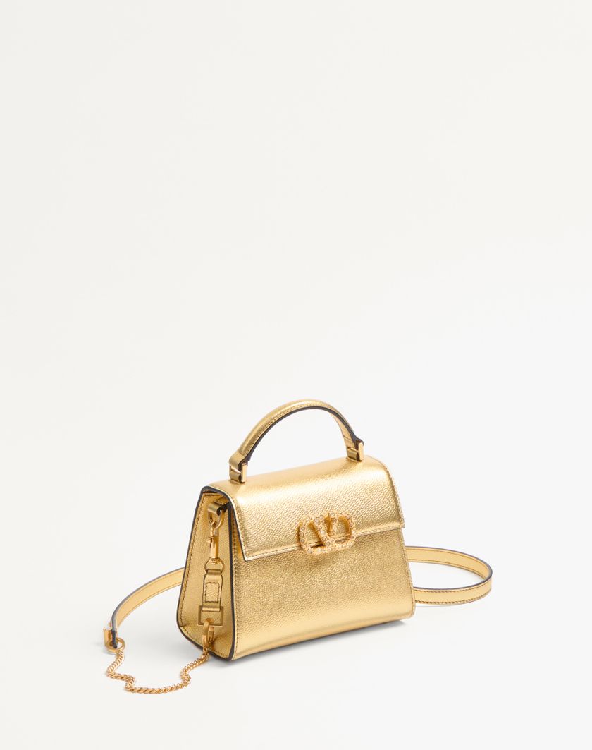 Valentino Handbags Borsa A Mano Mini Valentino Garavani Vsling In Vitello Granato Laminato Con Logo Gioiello per Donna in Violet | Valentino IT I Più Venduti